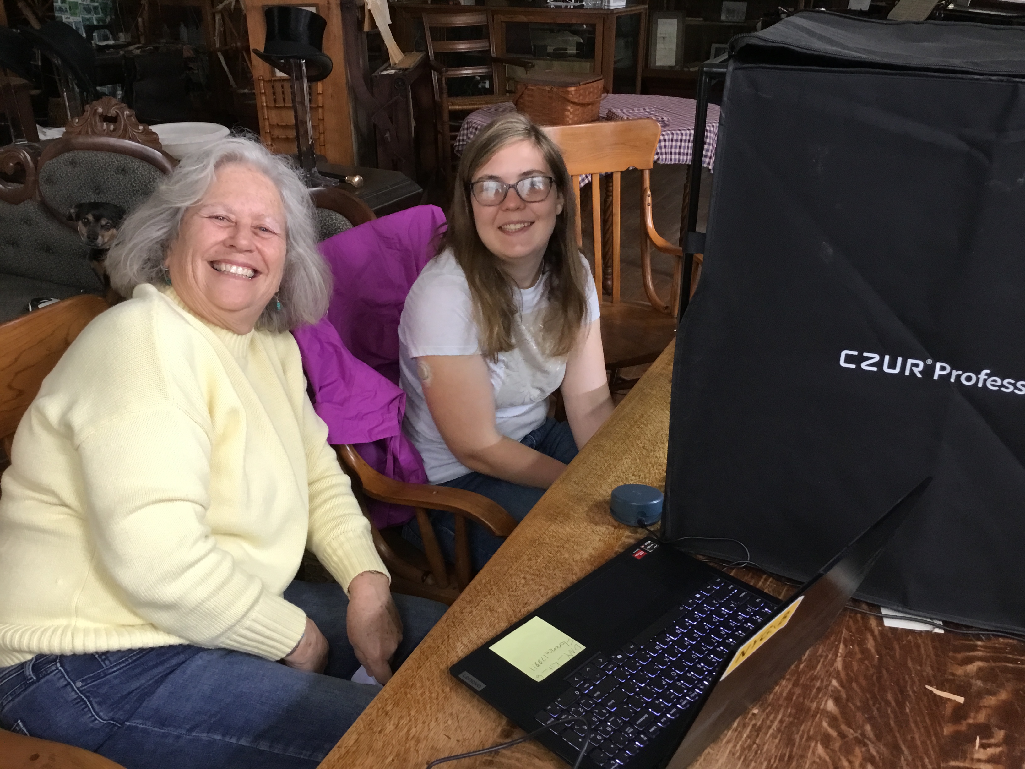 Volunteers Susan Eldridge, left, and Ally Kimball help scan records using a digitization kit at the Dundee Area Historical Society.