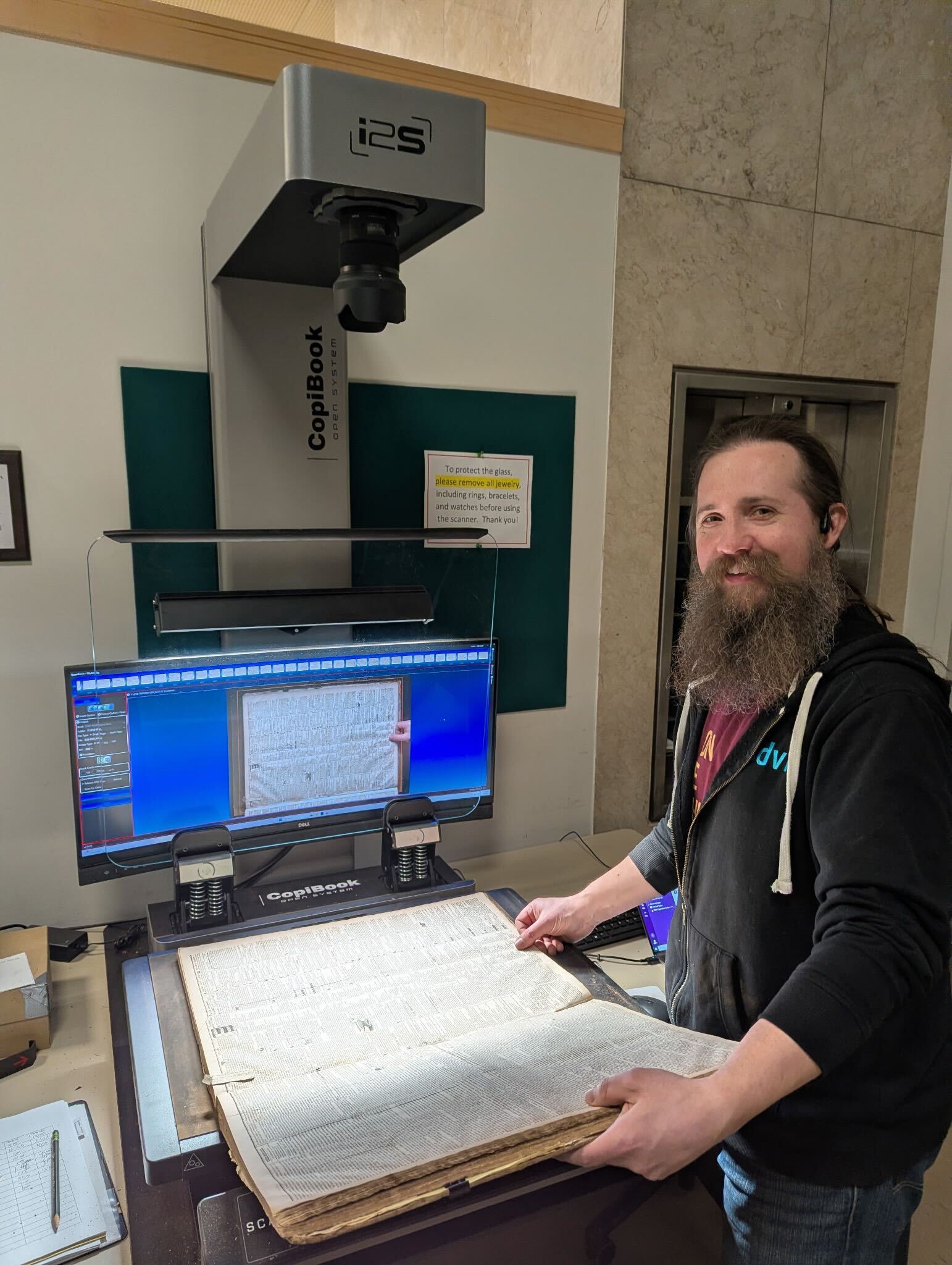 Michael Dudley digitizes materials from the Niagara County Historical Society at the Western New York Digitization Center