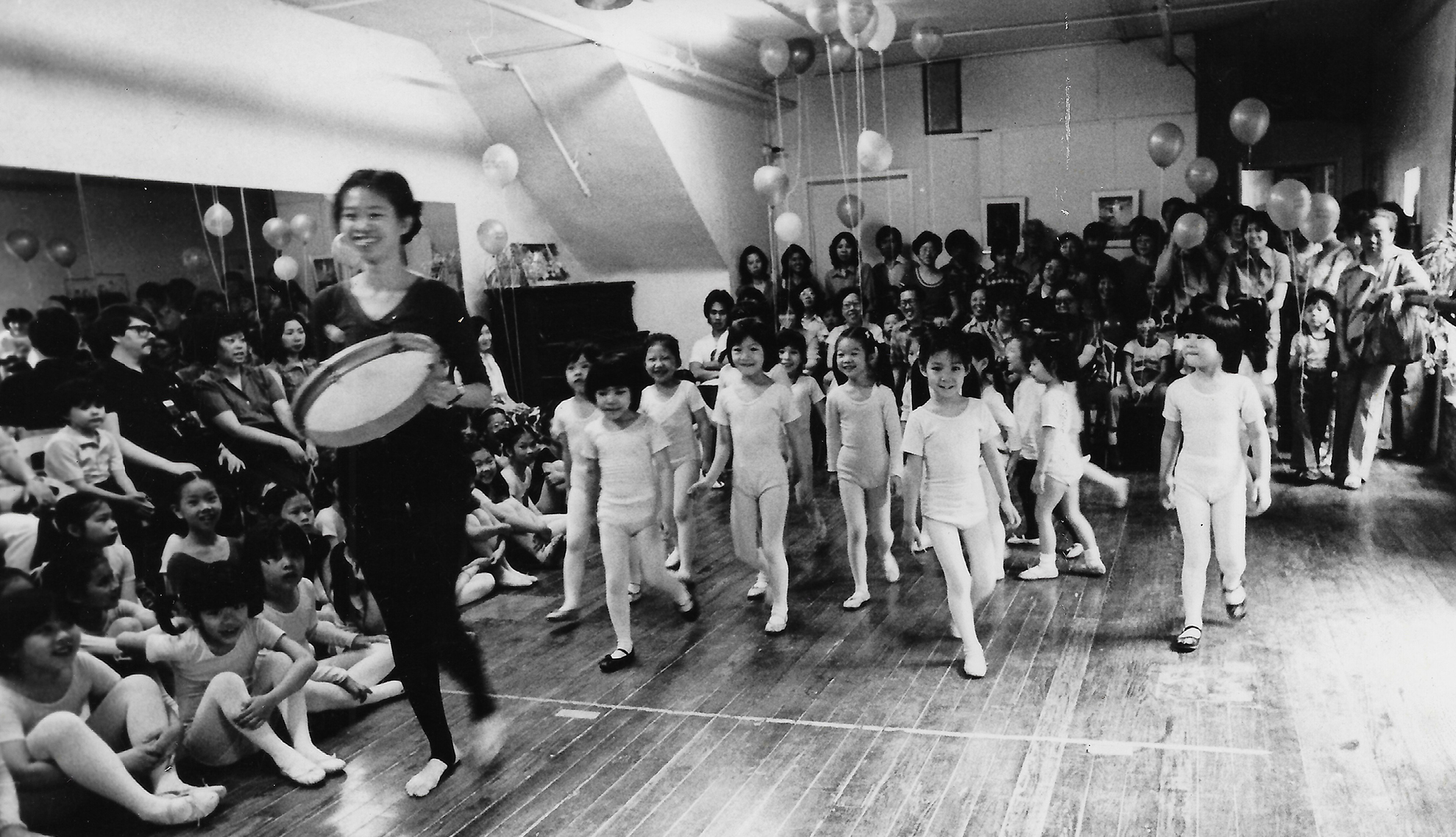 Black and white photo of students in Chinese dance studio