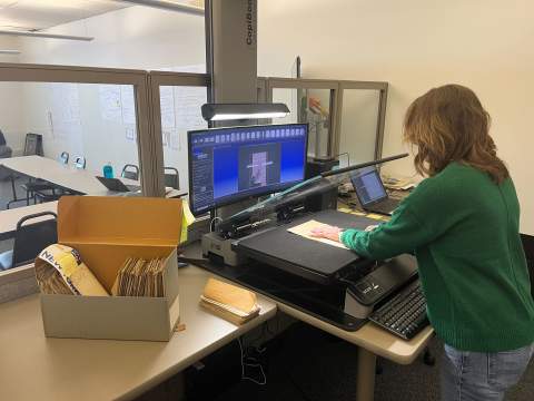 A volunteer scanning documents for the NYG&B's Digitize New York initiative in Syracuse, NY